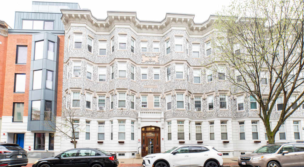 Decorative building facade with multiple windows at 71 Westland Apartments in Boston, Massachusetts