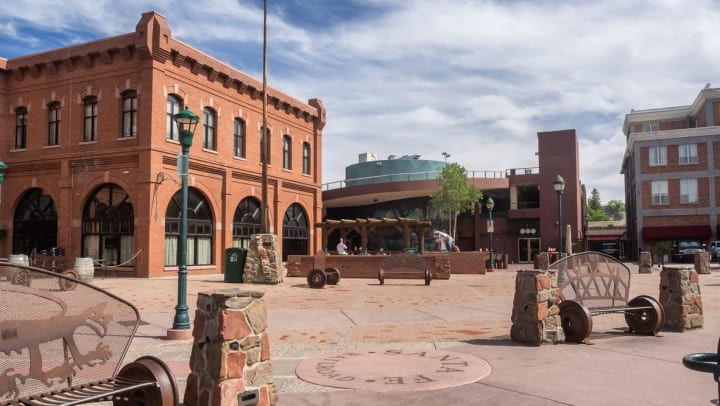 Historic downtown Flagstaff’s main square with brick buildings and benches