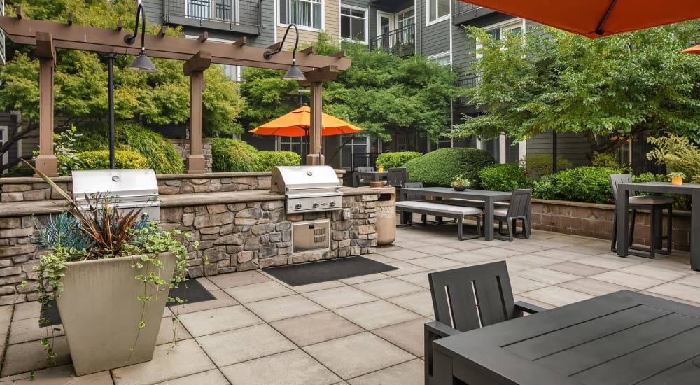 Communal patio with seating and bbq grill at Chateau Woods in Woodinville, Washington