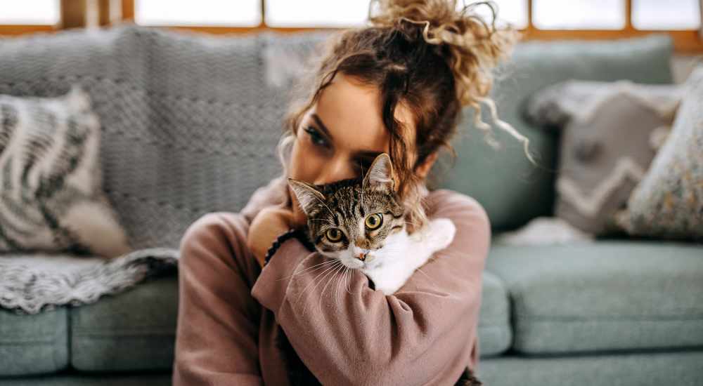 Resident with her cat at Box Board Lofts in Grand Rapids, Michigan