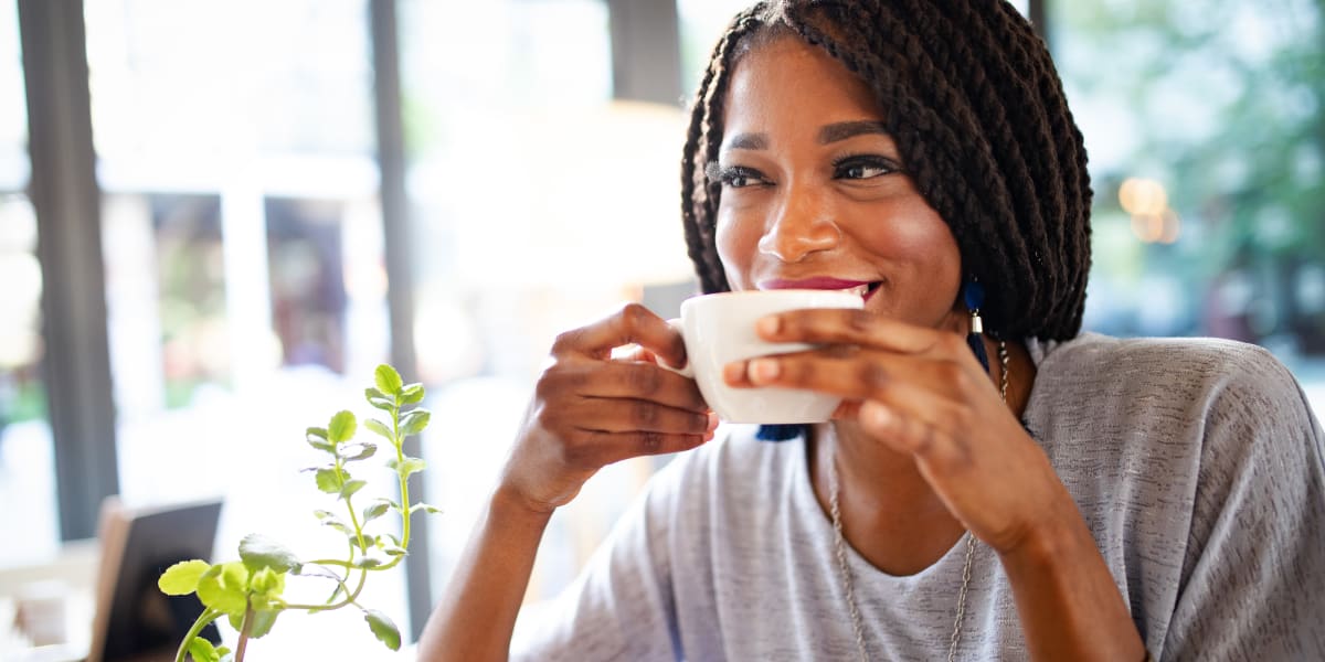 Resident enjoying a cup of coffee near Enclave at Grapevine in Grapevine, Texas