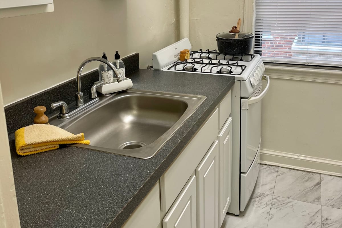 Nice kitchen with granite style counters at The Shoremeade Apartments in Washington, District of Columbia