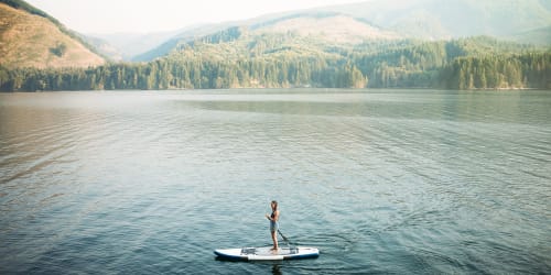 A paddleboarder on a lake near Ambrose in Bremerton, Washington