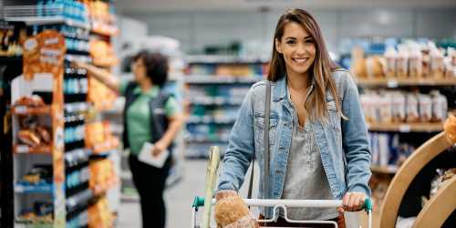 Resident buying groceries in a shopping mall near Rancho Niguel Apartments in Laguna Hills, California