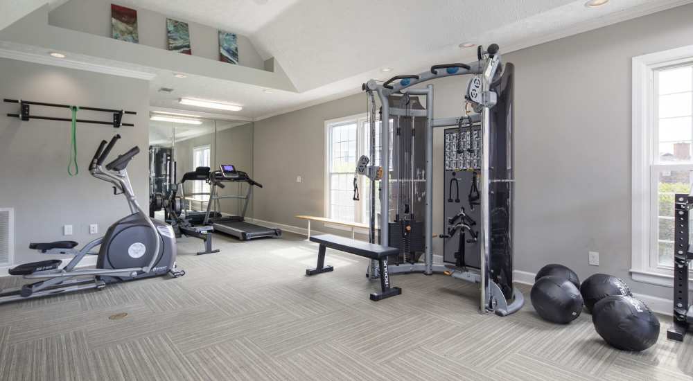 Fitness studio with treadmills and weight machines at Tapestry on Vaughn in Montgomery, Alabama