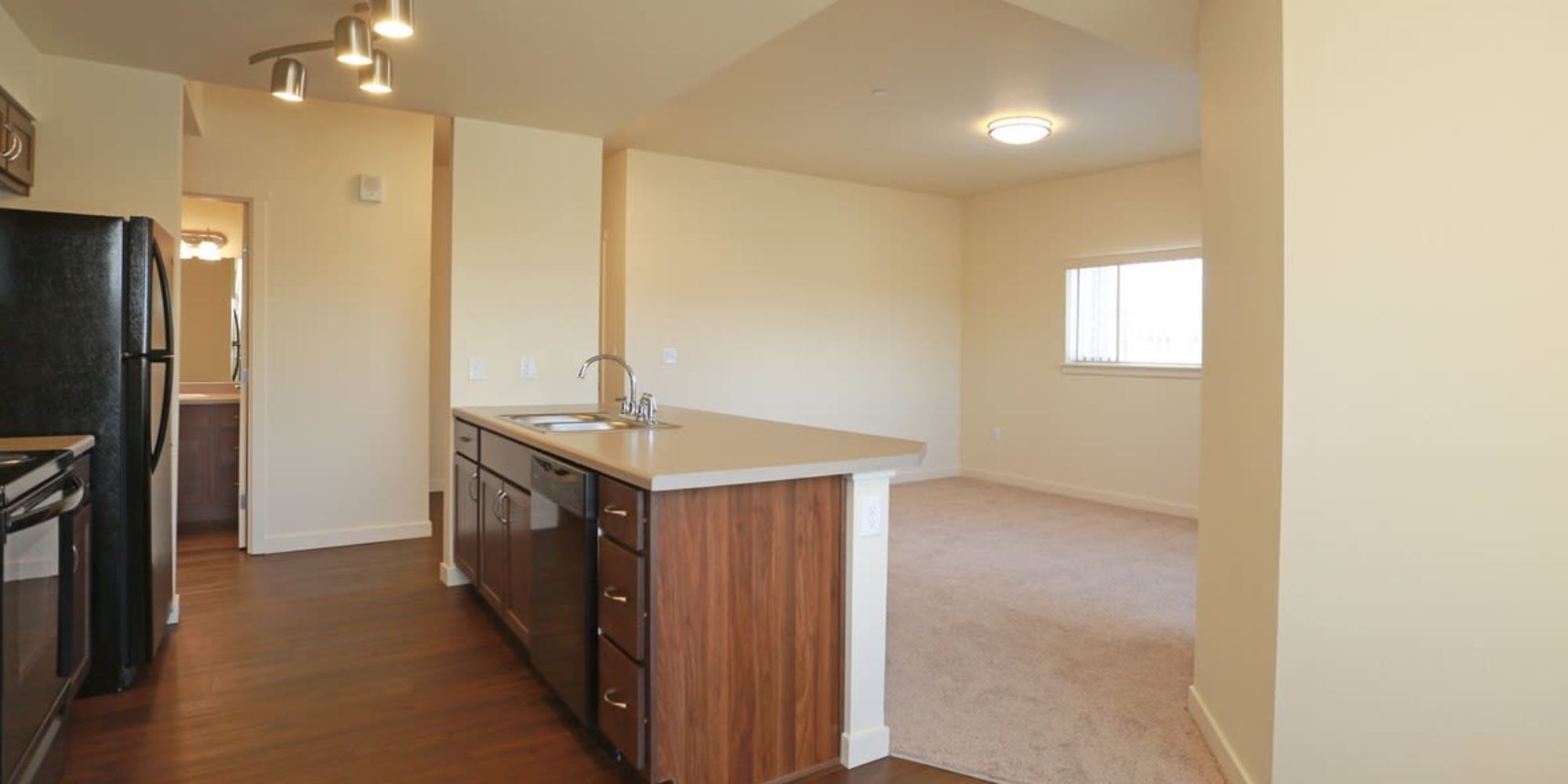 Spacious kitchen and living room at Copper Stone in Lafayette, Colorado