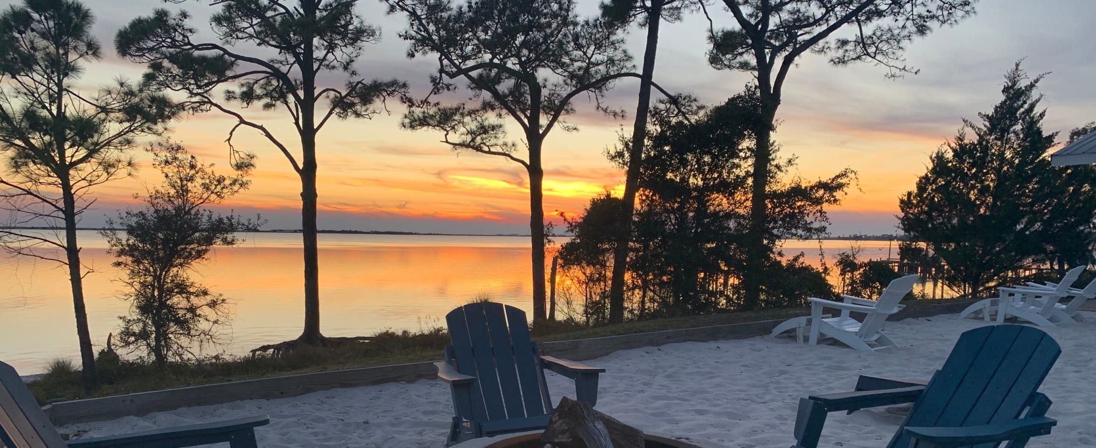 Sunset with comfy chairs and a firepit Photo Gallery | Emerald Shores in Mary Esther, Florida