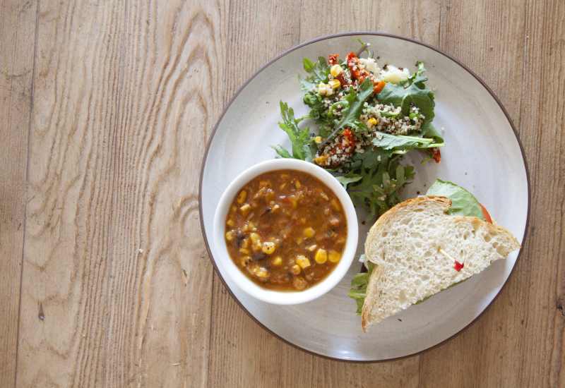 A hearty bowl of soup, half a sandwich, and a small salad at Truewood by Merrill, Clovis in Clovis, California