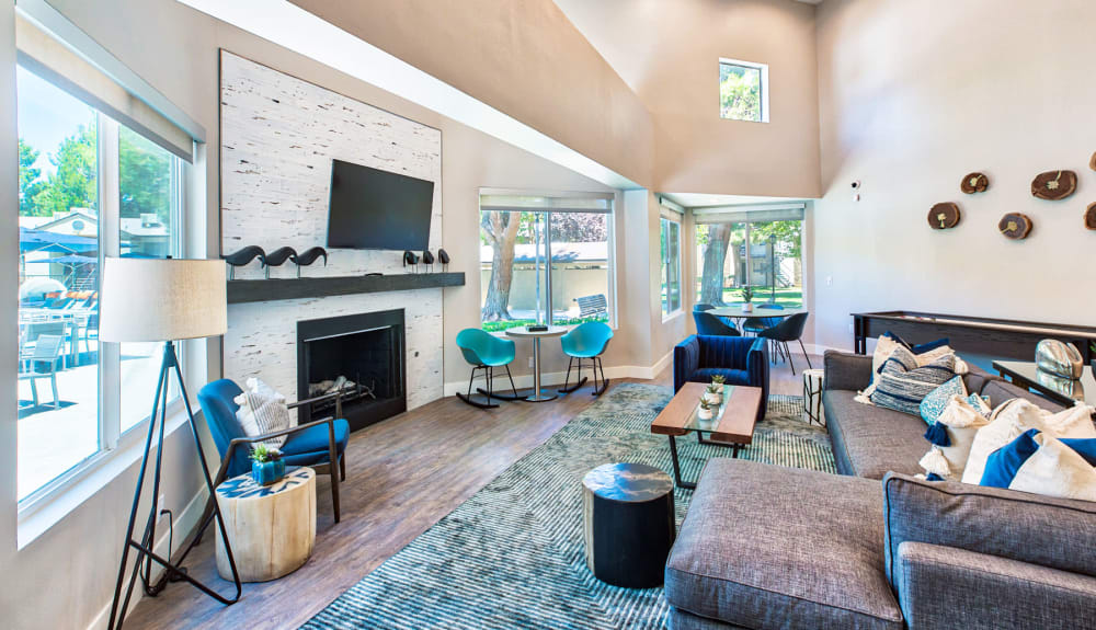 Beautifully designed lounge area in front of the fireplace in the clubhouse at Mountain Vista in Victorville, California