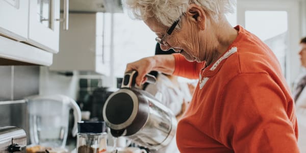 Resident preparing herself a cup of tea at Ingleside Communities in Mount Horeb, Wisconsin