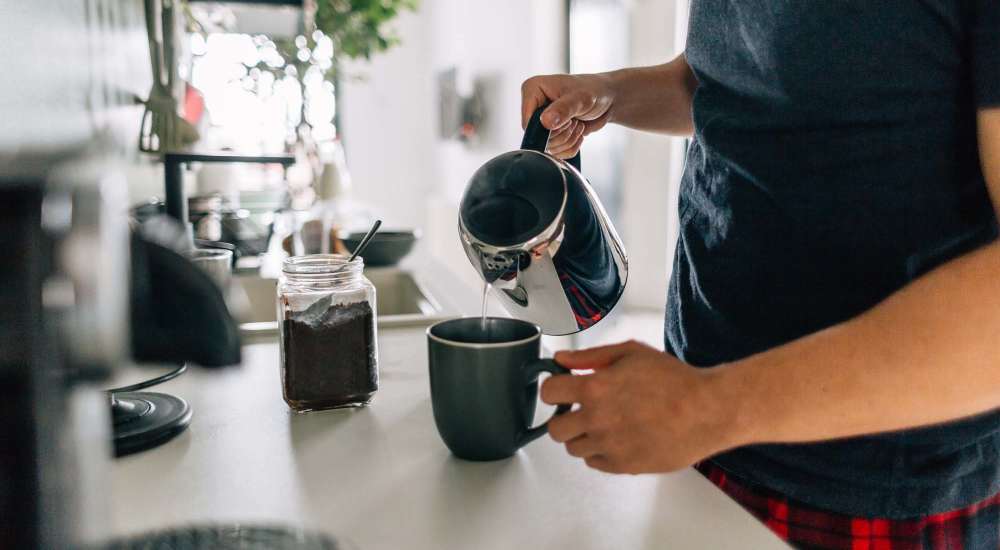 Resident making coffee at The Depot at North Salem in Apex, North Carolina