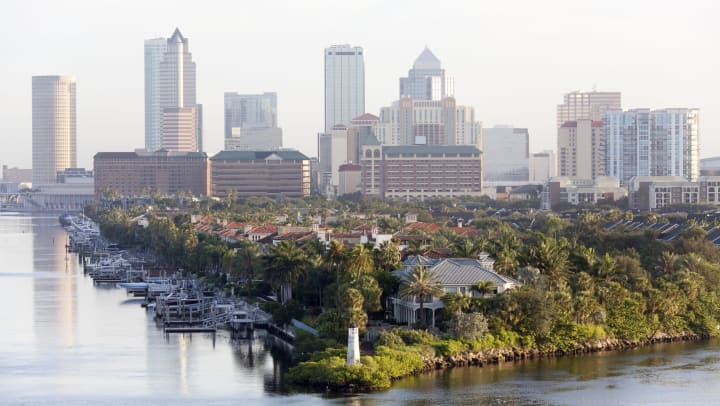 A morning view of Harbour Island point with a lighthouse and downtown Tampa, Florida
