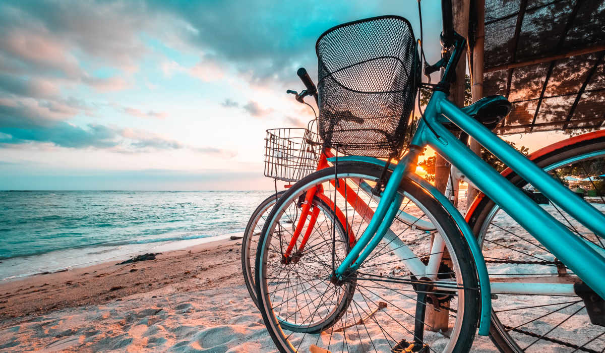 A row of bikes on a sandy beach near Artisan Living North Beach in Santa Rosa Beach, Florida