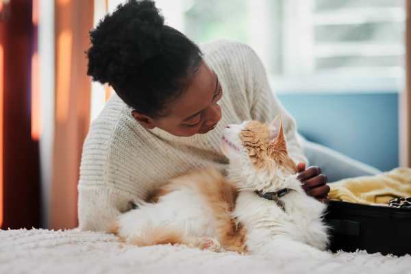 Happy cat and her owner in their new home at Glenridge Gardens in Augusta, Maine
