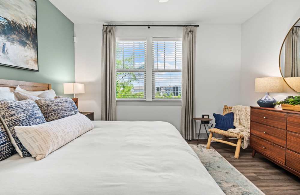 Modern bedroom with king size bed and two side lamp at Watersound Origins Crossings in Inlet Beach, Florida