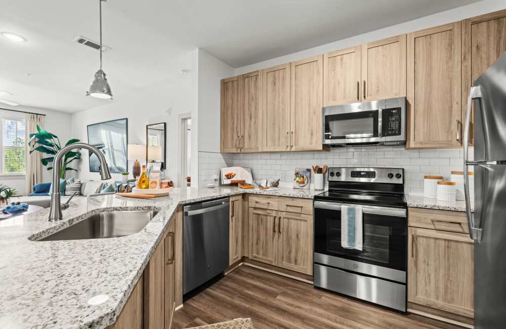 Modern kitchen with fully-equipped appliances at Watersound Origins Crossings in Inlet Beach, Florida