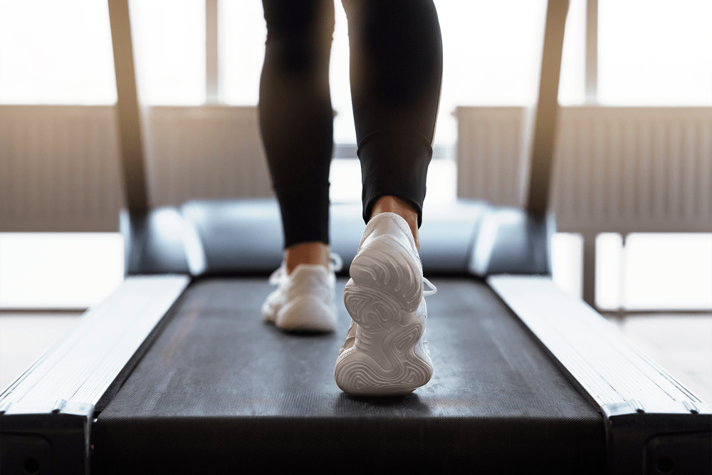 Close-up view of resident walking on a treadmill at Ravello 192 in Elkhorn, Nebraska