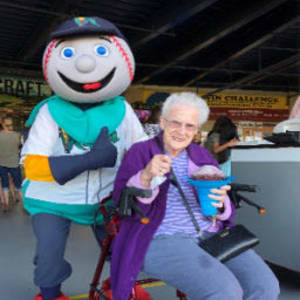 Resident Bev at a local baseball game for her Dare to Dream event near Corridor Crossing Place in Cedar Rapids, Iowa.