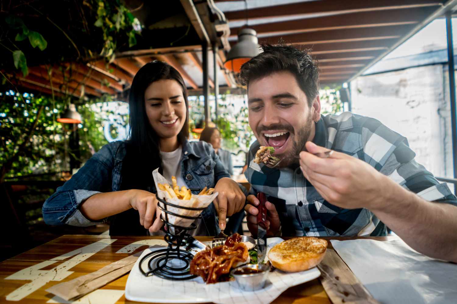 Couple having lunch in a restaurant near Lakewood Apartments in Stockbridge, Michigan