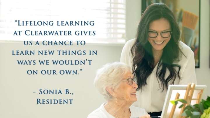 Resident at Clearwater at South Bay smiles while writing in a gratitude journal worksheet during a personal growth class as part of Clearwater Living