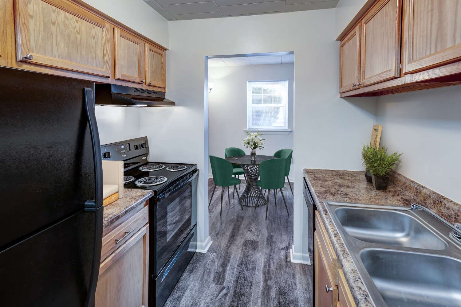 Kitchen with oak cabinets and black appliances