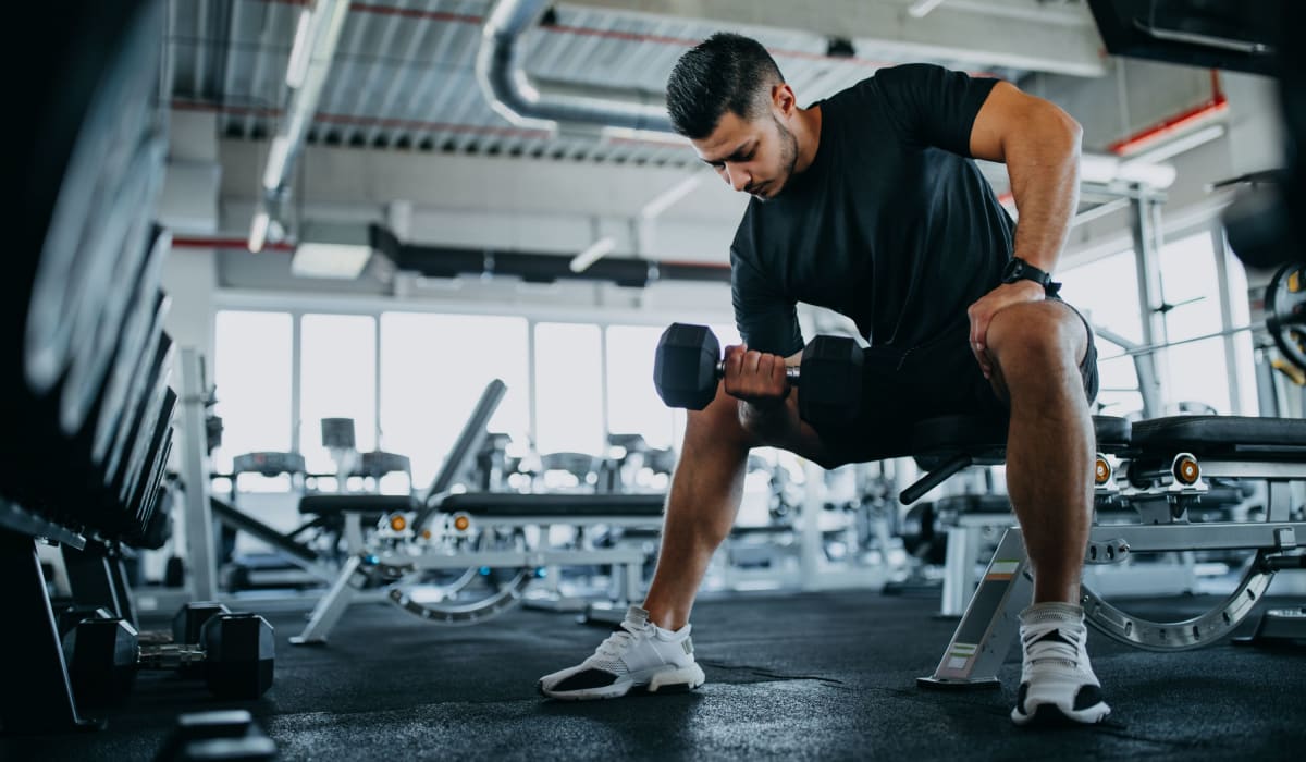 Resident lifting weights at Cobble Creek Apartment Homes in Chico, California