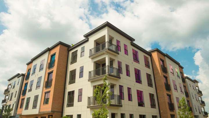 Modern apartment community with vibrant balconies at {{location_name}} in {{location_city}}, {{location_state_name}}