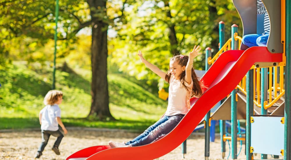 Kids playing happily in a park near The Crossing in Houston, Texas