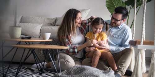 A happy family having a good time in the living room at Orange Wood Court in Sherman Oaks, California