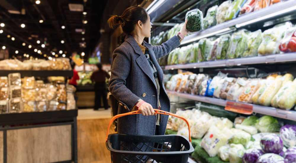 Resident woman buying some food items in a nearby supermarket at Retreat at Redstone in Crestview, Florida
