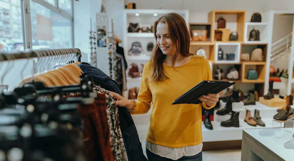 Resident shopping clothes near The Apartments at Goose Creek in Fishersville, Virginia