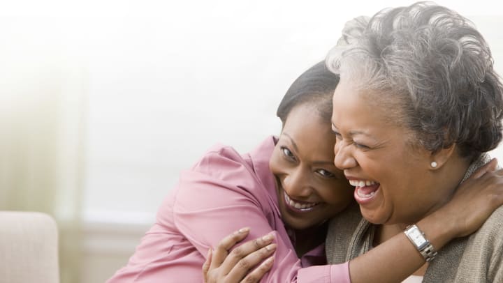 mom and daughter hugging 