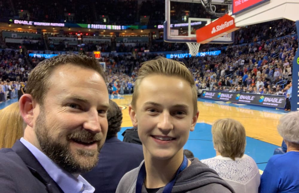 Michael, from Touchmark at Coffee Creek in Edmond, Oklahoma, and his son at a Thunder's game