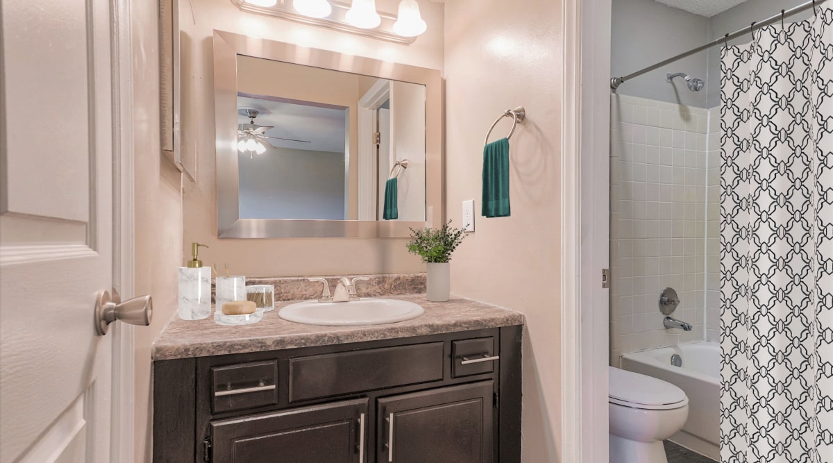 Bathroom with solid countertops at The Gatsby at Midtown Apartment Living in Montgomery, Alabama