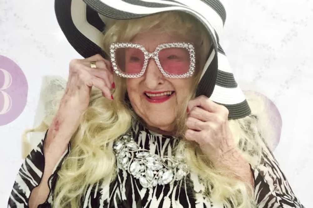 Resident wearing pink large-framed glasses at Ashley Park in Charleston, South Carolina