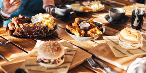 Residents enjoying a feast at their favorite restaurant near 266 LOFTS in Memphis, Tennessee