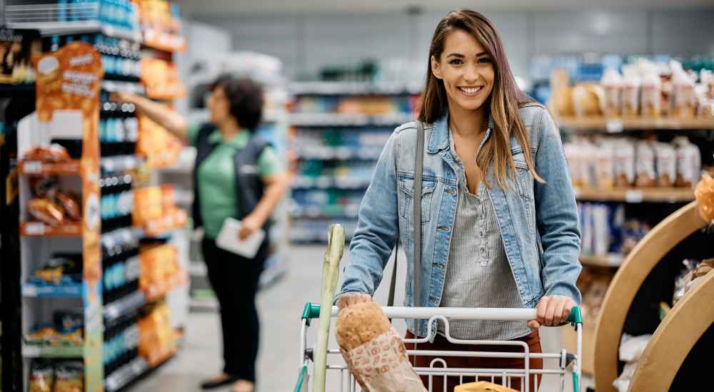 Resident woman buying groceries at store near to Preserve At Columbus Park in Columbus, Georgia