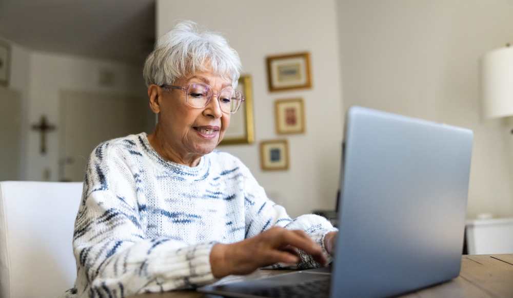 Woman using laptop at The Cascalote in Glendale, Arizona