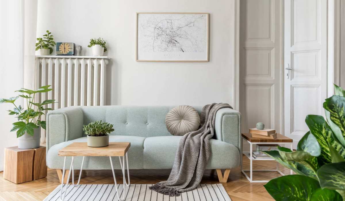 Living room with wooden flooring at Beaumont Oaks At Porters Neck Apartments & Townhomes in Wilmington, North Carolina