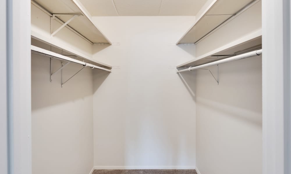 Bathroom with a toilet and a large mirror at Vantage Pointe West Apartment Homes in Cincinnati, Ohio