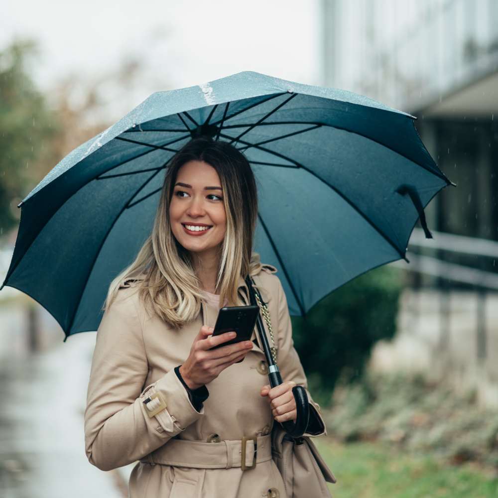 Woman scheduling a tour of The Ridge from her phone in Merrillville, Indiana