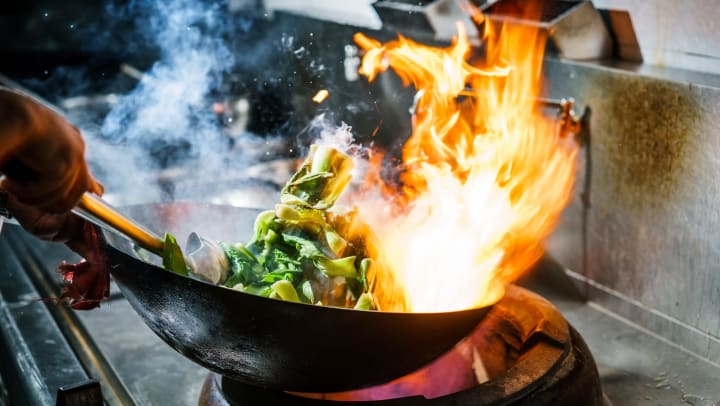 Sizzling vegetables in a large wok at a restaurants in Albuquerque