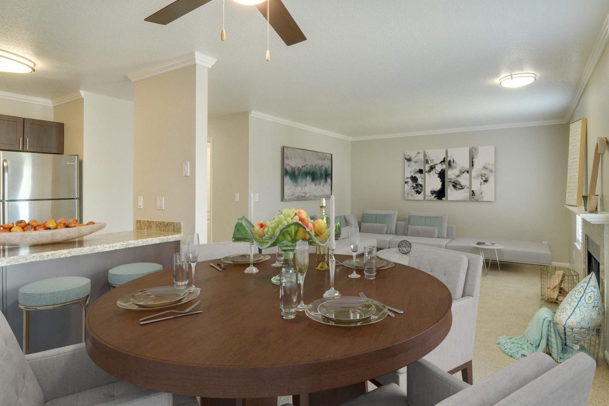 Dining room looking into the kitchen and living room at Carriage House Apartments in Vancouver, Washington