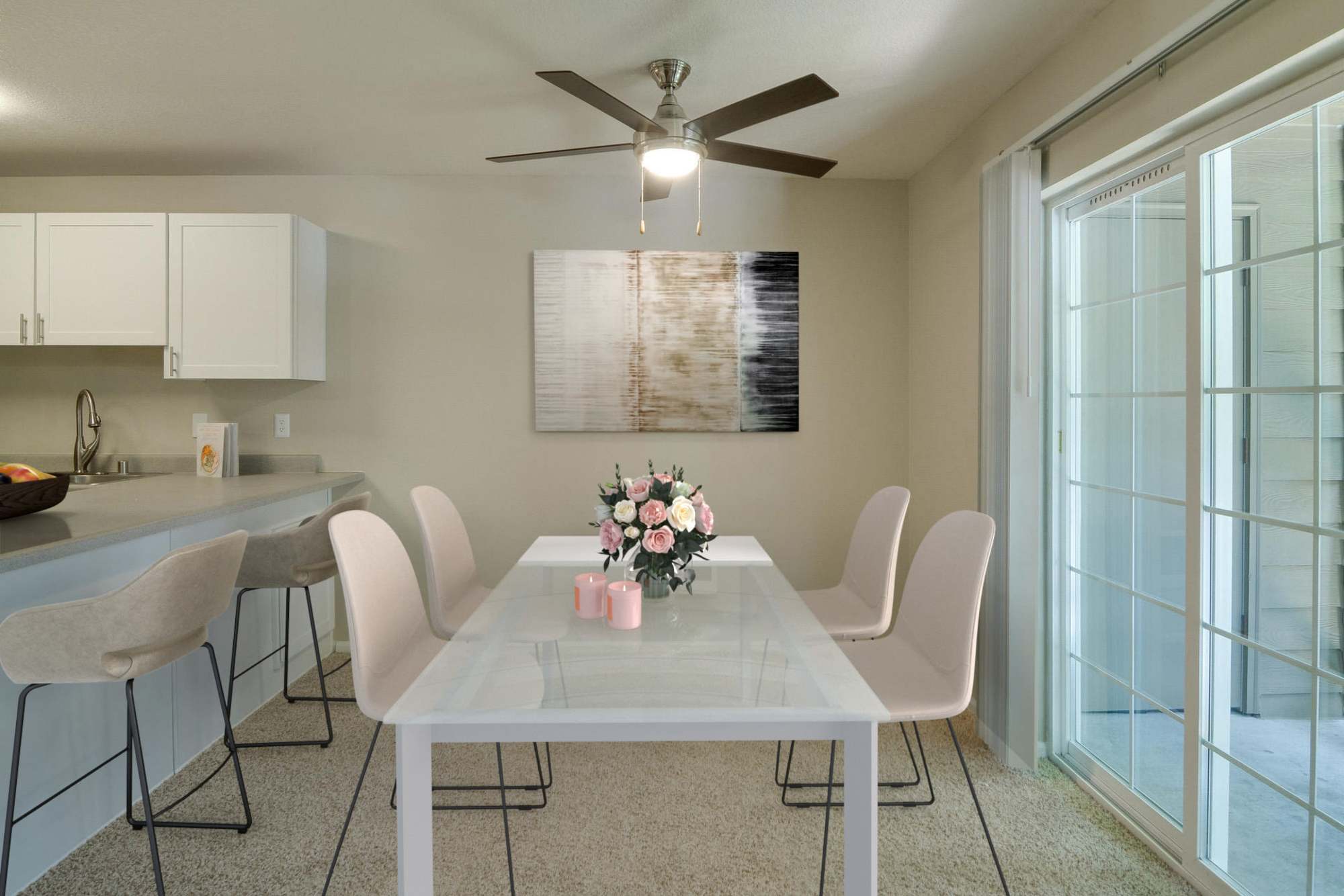 Dining room with a ceiling fan at Carriage House Apartments in Vancouver, Washington