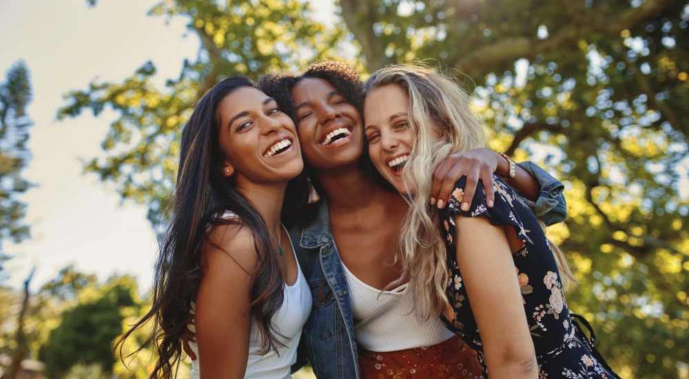 Resident friends are enjoying their free time in a local park near Helios in Richmond, Virginia