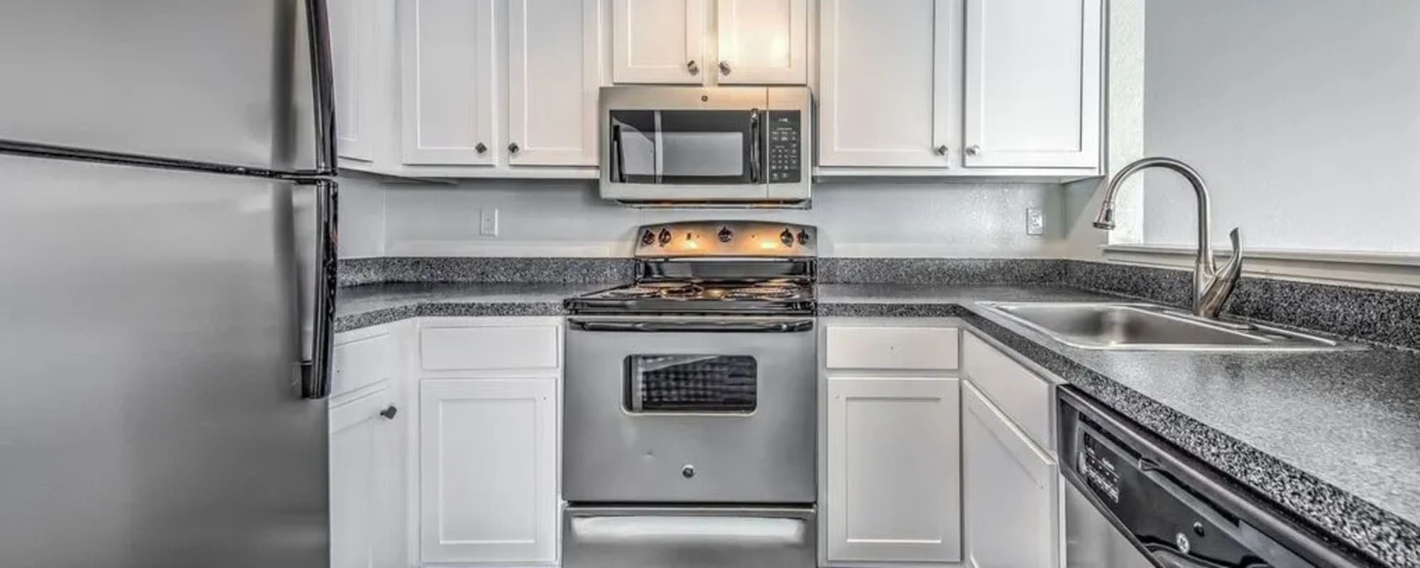 Modern kitchen with stainless-steel appliances at Silver Bay Apartments in Boise, Idaho