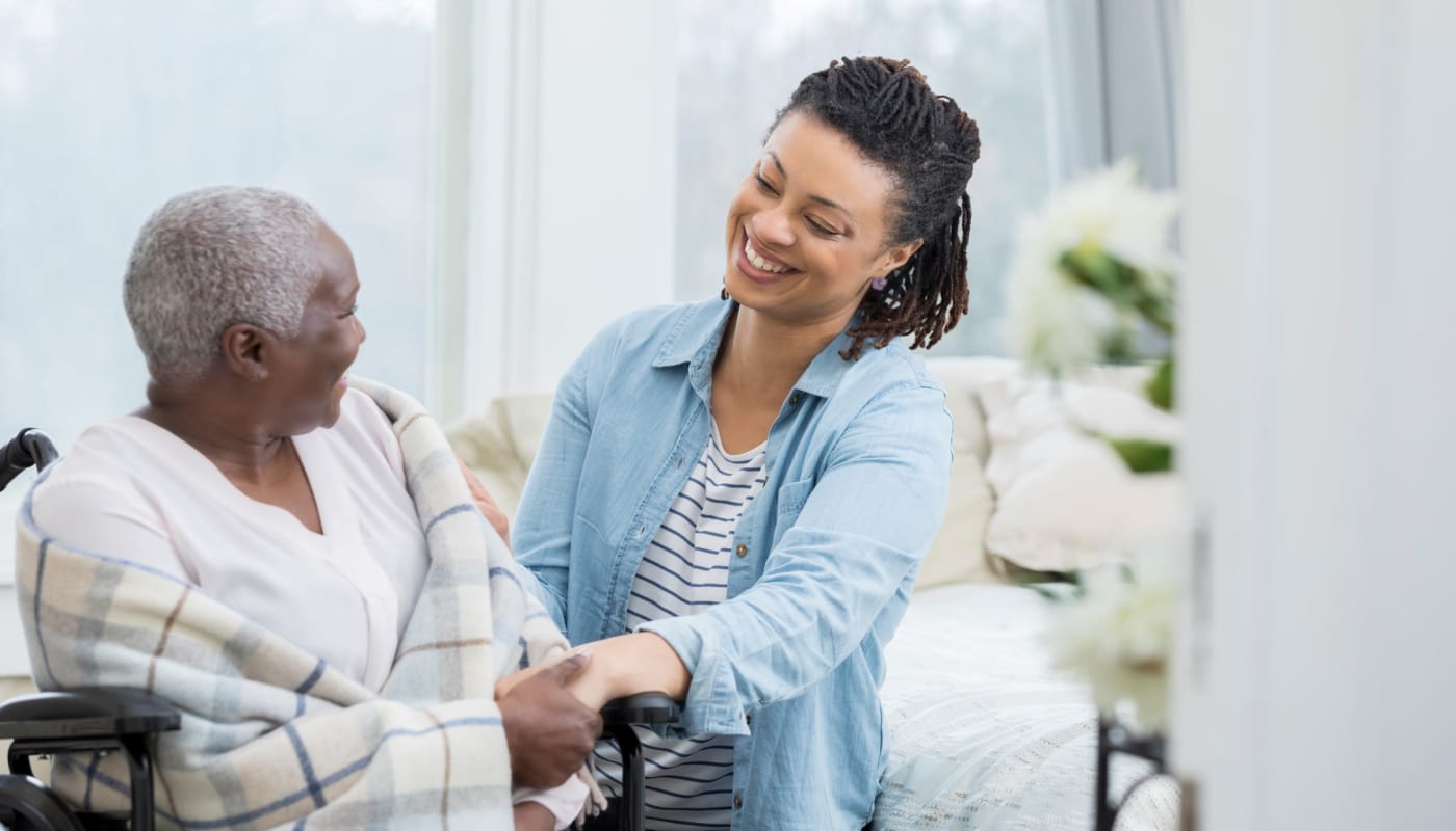 Caretaker helping a resident at Willows Landing in Monticello, Minnesota.
