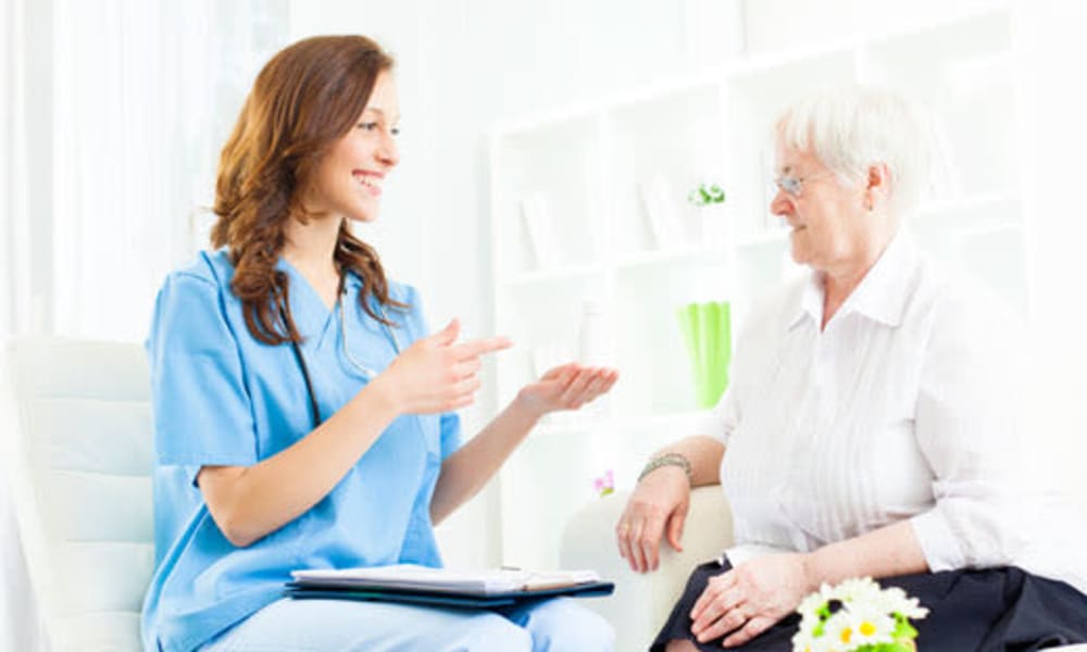 A caretaker from Chestnut Knoll at Home in Boyertown, Pennsylvania having a discussion with a resident