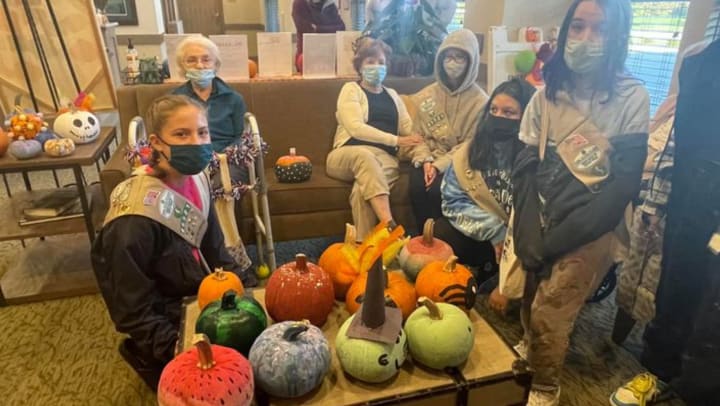 Girl scouts bring a special gift to residents of Emerald Place memory care in Glenview, Illinois
