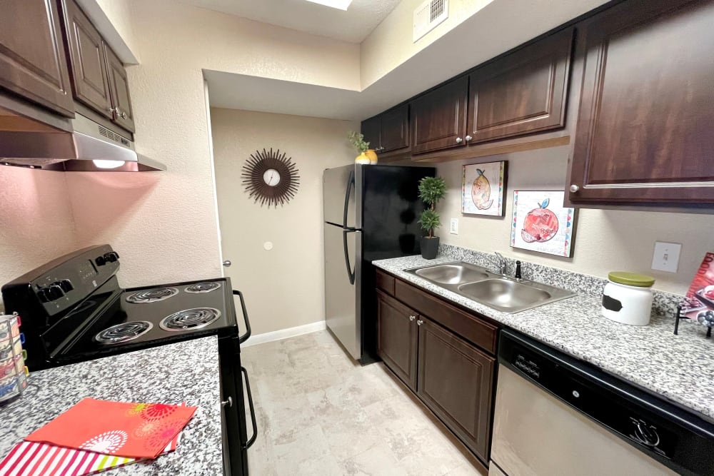 Kitchen with modern appliances at The Abbey at Conroe in Conroe, Texas
